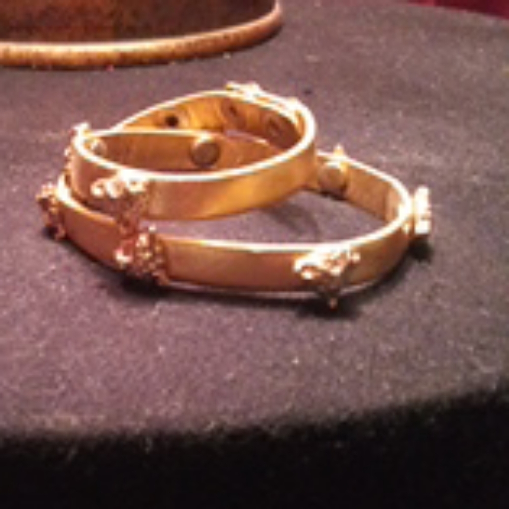 Gold wrap bracelet with lion heads